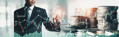 Businessman analyst working with digital finance business data graph showing technology of investment strategy for perceptive financial business decision. Digital economic analysis technology concept.