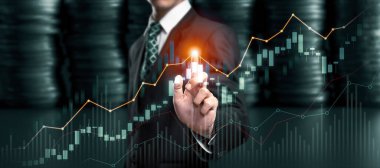 Businessman analyst working with digital finance business data graph showing technology of investment strategy for perceptive financial business decision. Digital economic analysis technology concept.
