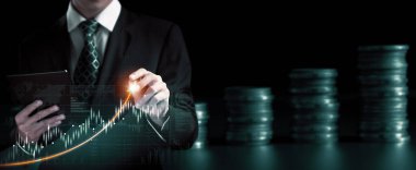 Businessman analyst working with digital finance business data graph showing technology of investment strategy for perceptive financial business decision. Digital economic analysis technology concept.