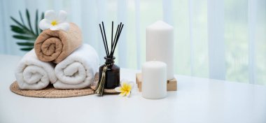 Spa accessory composition set in day spa hotel , beauty wellness center . Spa product are placed in luxury spa resort room , ready for massage therapy from professional service .