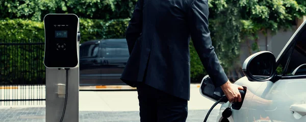 Closeup Progressive Black Suit Businessman Insert Charger Plug Public Charging — Stock fotografie