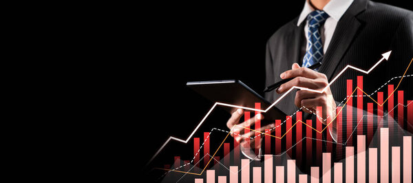 Businessman analyst working with digital finance business data graph showing technology of investment strategy for perceptive financial business decision. Digital economic analysis technology concept.