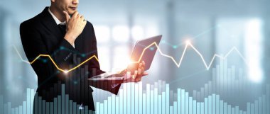Businessman analyst working with digital finance business data graph showing technology of investment strategy for perceptive financial business decision. Digital economic analysis technology concept.