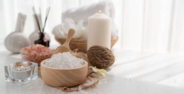 Spa accessory composition set in day spa hotel , beauty wellness center . Spa product are placed in luxury spa resort room , ready for massage therapy from professional service .
