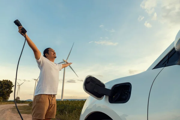 Progressive Man Spread Arm Electric Car Recharge Energy Charging Station — Fotografia de Stock