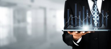 Businessman analyst working with digital finance business data graph showing technology of investment strategy for perceptive financial business decision. Digital economic analysis technology concept.