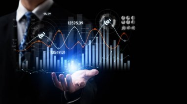 Businessman analyst working with digital finance business data graph showing technology of investment strategy for perceptive financial business decision. Digital economic analysis technology concept.