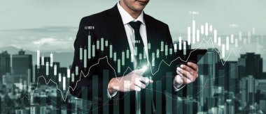 Businessman analyst working with digital finance business data graph showing technology of investment strategy for perceptive financial business decision. Digital economic analysis technology concept.