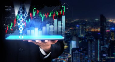Businessman analyst working with digital finance business data graph showing technology of investment strategy for perceptive financial business decision. Digital economic analysis technology concept.