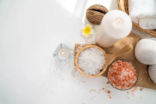 Spa accessory composition set in day spa hotel , beauty wellness center . Spa product are placed in luxury spa resort room , ready for massage therapy from professional service .