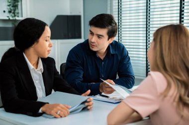 A young female asian candidate tries to impress her interviewer by being competent. International company, multicultural environment in workplace.