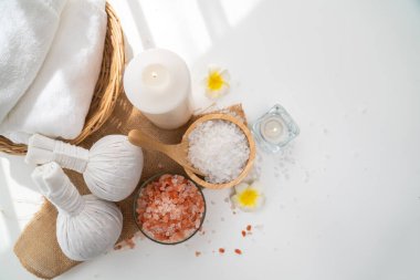 Spa accessory composition set in day spa hotel , beauty wellness center . Spa product are placed in luxury spa resort room , ready for massage therapy from professional service .