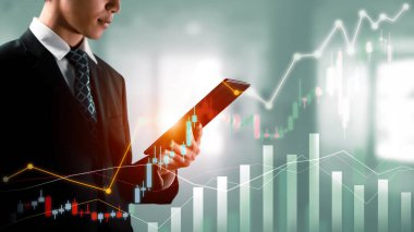 Businessman analyst working with digital finance business data graph showing technology of investment strategy for perceptive financial business decision. Digital economic analysis technology concept.