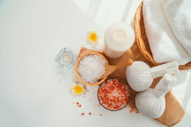 Spa accessory composition set in day spa hotel , beauty wellness center . Spa product are placed in luxury spa resort room , ready for massage therapy from professional service .