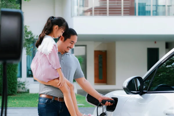 Progressive Father Daughter Returned School Electric Vehicle Being Charged Home — Foto Stock
