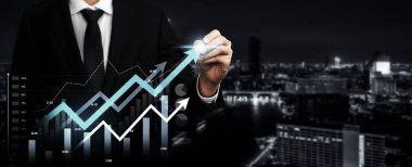 Businessman analyst working with digital finance business data graph showing technology of investment strategy for perceptive financial business decision. Digital economic analysis technology concept.
