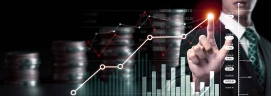 Businessman analyst working with digital finance business data graph showing technology of investment strategy for perceptive financial business decision. Digital economic analysis technology concept.
