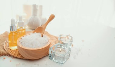 Spa accessory composition set in day spa hotel , beauty wellness center . Spa product are placed in luxury spa resort room , ready for massage therapy from professional service .