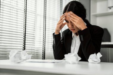 A competent female employee who has become completely exhausted as a result of overburdened work. Concept of unhealthy life as an office worker, office syndrome, effect from overwork.