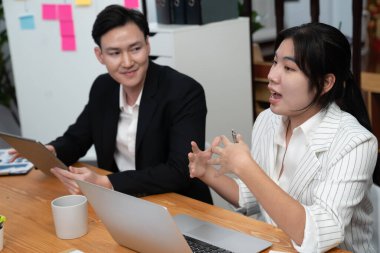 Business team of financial data analysis meeting with business intelligence, report paper and dashboard on laptop for marketing strategy. Business people working together to promote harmony in office.