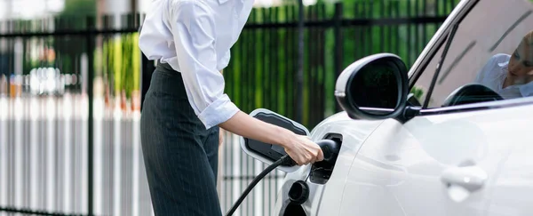Closeup Progressive Suit Clad Businesswoman Her Electric Vehicle Recharge Her — Stock Fotó