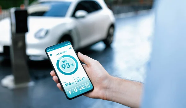 Closeup Progressive Businessman Look Cars Battery Status Application Smart Phone — ストック写真