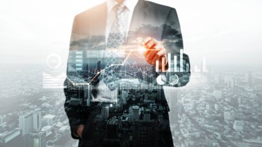 Businessman analyst working with digital finance business data graph showing technology of investment strategy for perceptive financial business decision. Digital economic analysis technology concept.