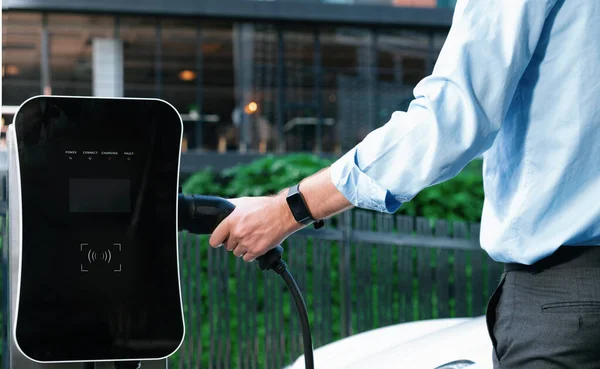 Closeup Progressive Man Holding Charger Plug Public Charging Station Electric — 图库照片