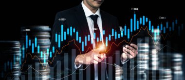 Businessman analyst working with digital finance business data graph showing technology of investment strategy for perceptive financial business decision. Digital economic analysis technology concept.