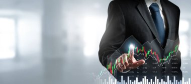 Businessman analyst working with digital finance business data graph showing technology of investment strategy for perceptive financial business decision. Digital economic analysis technology concept.