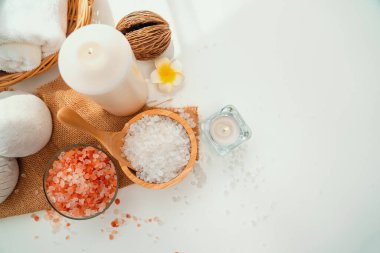 Spa accessory composition set in day spa hotel , beauty wellness center . Spa product are placed in luxury spa resort room , ready for massage therapy from professional service .