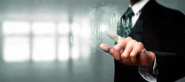 Businessman analyst working with digital finance business data graph showing technology of investment strategy for perceptive financial business decision. Digital economic analysis technology concept.