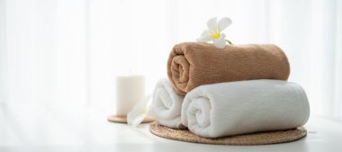 Spa accessory composition set in day spa hotel , beauty wellness center . Spa product are placed in luxury spa resort room , ready for massage therapy from professional service .