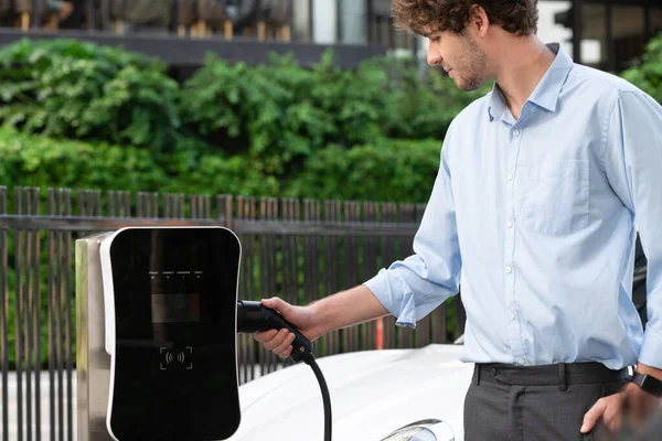 Progressive Businessman Insert Charger Plug Charging Station His Electric Vehicle — Stock Fotó