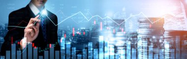 Businessman analyst working with digital finance business data graph showing technology of investment strategy for perceptive financial business decision. Digital economic analysis technology concept.