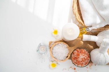 Spa accessory composition set in day spa hotel , beauty wellness center . Spa product are placed in luxury spa resort room , ready for massage therapy from professional service .