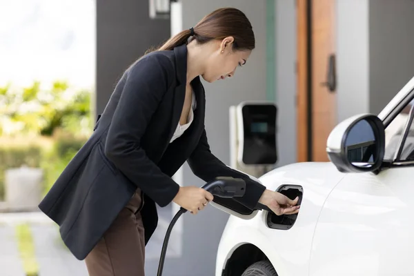 Progressive Woman Install Cable Plug Her Electric Car Home Charging — Foto Stock