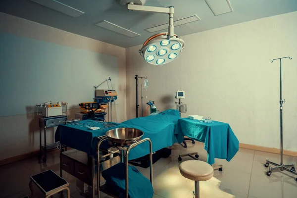 stock image Sterile operation room in the hospital display sets of medical surgical equipments arranged on the table. Surgery room with surgical tools background for medical purpose.