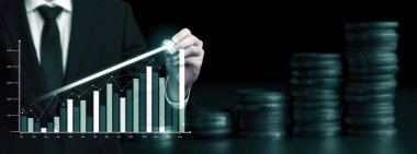Businessman analyst working with digital finance business data graph showing technology of investment strategy for perceptive financial business decision. Digital economic analysis technology concept.