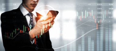 Businessman analyst working with digital finance business data graph showing technology of investment strategy for perceptive financial business decision. Digital economic analysis technology concept.