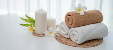 Spa accessory composition set in day spa hotel , beauty wellness center . Spa product are placed in luxury spa resort room , ready for massage therapy from professional service .