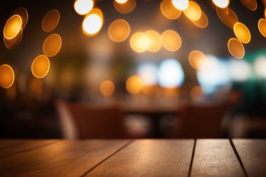 Empty wood table for product display in blur background of admirable restaurant at night