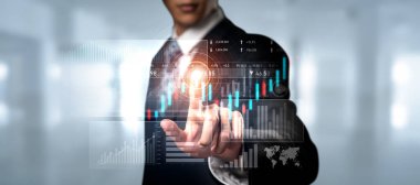 Businessman analyst working with digital finance business data graph showing technology of investment strategy for perceptive financial business decision. Digital economic analysis technology concept.