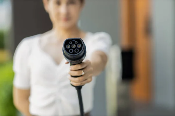 Focus Hand Holding Pointing Charger Plug Electric Vehicle Camera Blur — Stock Photo, Image
