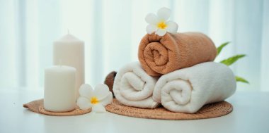 Spa accessory composition set in day spa hotel , beauty wellness center . Spa product are placed in luxury spa resort room , ready for massage therapy from professional service .