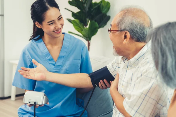 Elderly Man Having Blood Pressure Check His Personal Caregiver His — 스톡 사진