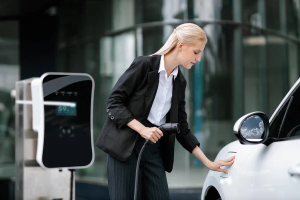 Progressive Businesswoman Insert Charger Plug Charging Station Her Electric Vehicle — 스톡 사진