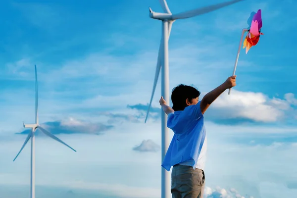 Progressive Young Asian Boy Playing Wind Pinwheel Toy Wind Turbine — Stok fotoğraf