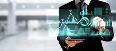 Businessman analyst working with digital finance business data graph showing technology of investment strategy for perceptive financial business decision. Digital economic analysis technology concept.