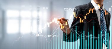 Businessman analyst working with digital finance business data graph showing technology of investment strategy for perceptive financial business decision. Digital economic analysis technology concept.